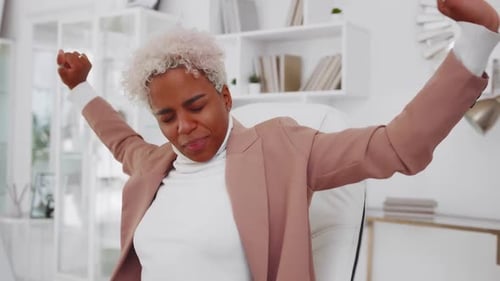 Woman Stretching at Office Workplace Desk