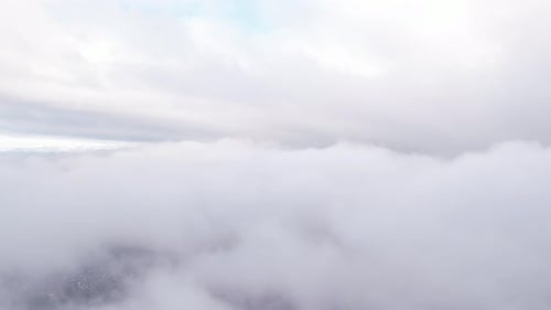 Aerial View of Clouds over an Expansive City