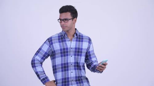 Young Man Frustrated with Smartphone