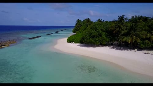Aerial drone shot travel of idyllic seashore beach journey by blue ocean and clean sand background o