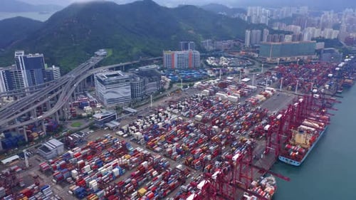 Aerial top view of container in logistics or shipping business at Victoria Harbour, Hong Kong.
