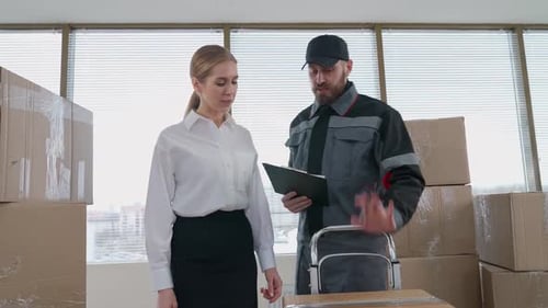 Moving to a New Office Woman Office Manager Accepts a Large Number Delivered Parcels in Cardboard