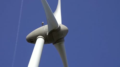 Windmill or Wind Turbine Closeup in Rotation