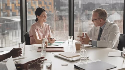 Medical Professionals Collaborate in Modern Conference Room