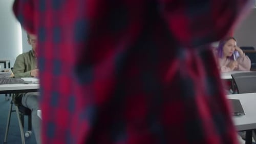 Attentive Student Working in Bright Classroom Environment