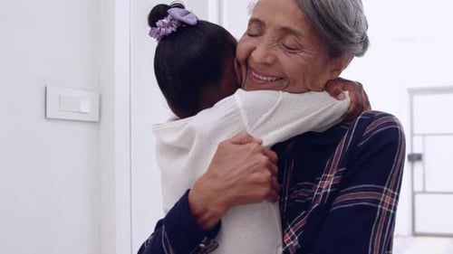 Grandmother and Child Tenderly Embrace at Home