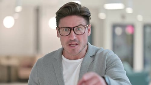 Angry Man Yelling and Gesturing Aggressively