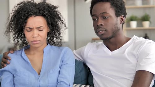 African Man Talking with Sad Girlfriend