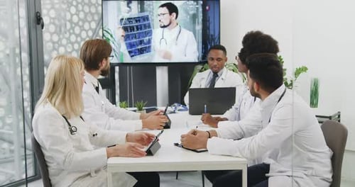 Medical Team in Video Conference Discussing X-Ray