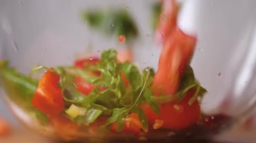 Fresh Vegetables Falling Into Tho Bowl Salad Tomato Cucumber Pepper Drops on Kitchen Healthy Close