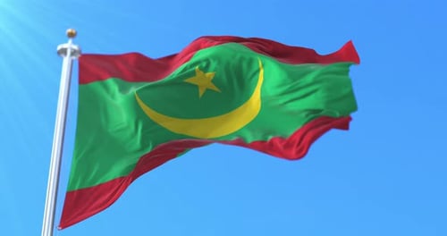 Realistic Mauritania Flag Waving Against Blue Sky