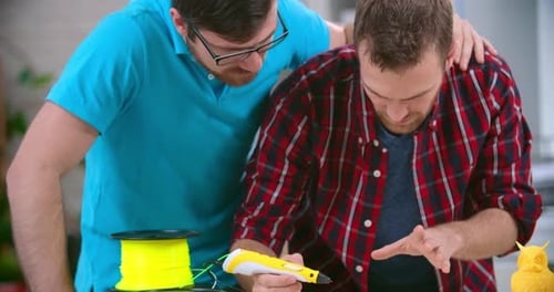 Men Collaborating on 3D Printing Project Together