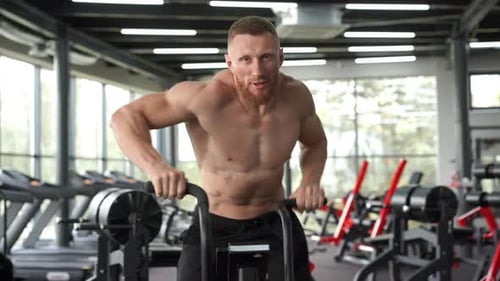 Man Exercise Bike Gym Cycling Training Fitness. Fitness Male Using Air Bike Cardio Workout.