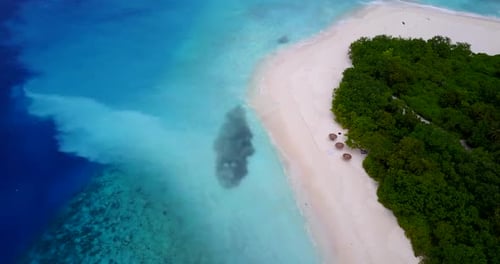 Daytime above island view of a paradise sunny white sand beach and aqua blue water background in hi