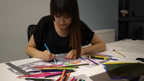 Woman Working on Colorful Architectural Drawing
