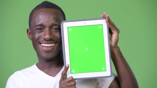 Man Holding Tablet with Chroma Key Screen