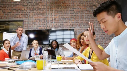 Diverse Team Discussing Business at Conference Table