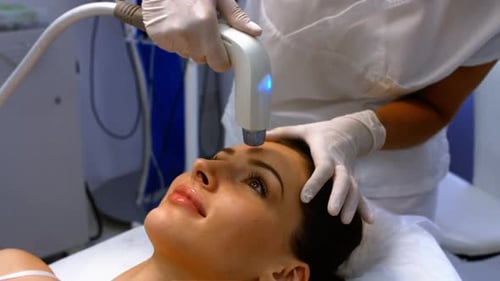 Woman Receiving Cosmetic Treatment in Medical Setting