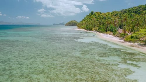 Aerial Drone Flying Over Shallow Clear Water Near to Paradise Tropical Beach