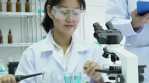 Female Scientist Working in a Modern Lab