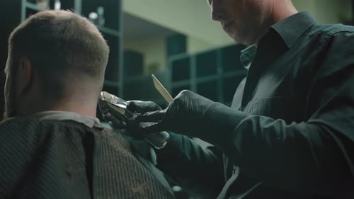 Barber Trims Short Hair in a Barbershop