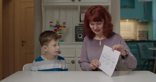 Autism Psychologist Teaching Kid with Autism Emotions