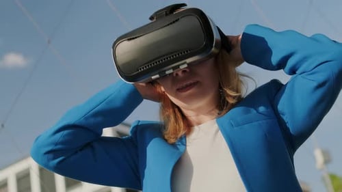 Woman Experiencing Virtual Reality Headset Outdoors