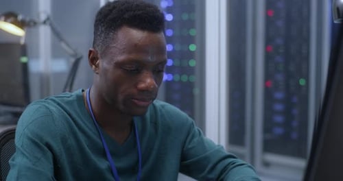 Young Man Working in Data Center