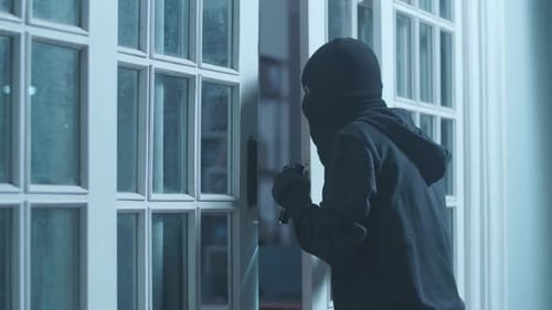Masked Intruder Attempts to Break Into Building