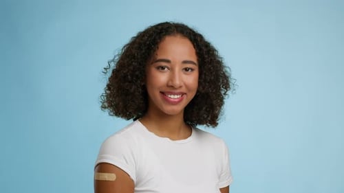Smiling Woman with Bandage on Arm Close Up