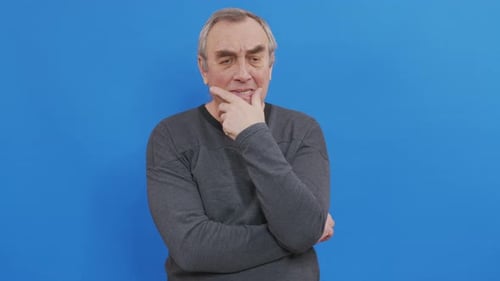 Upset Adult Man Despondent in Front of Blue Screen