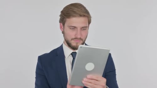 Young Adult Man Using Tablet in Suit