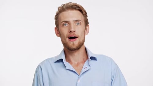 Smiling Young Man Expresses Joy and Excitement