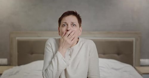 Woman Scared Looks Into the Camera Feels Horror Trembles Closes Her Eyes and Face Scared of Bad News