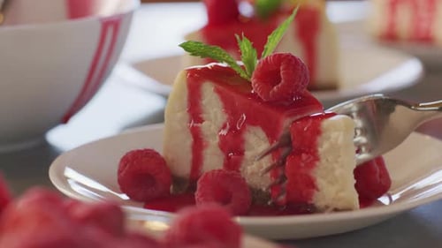 Delicious Raspberry Cheesecake Served as Dessert
