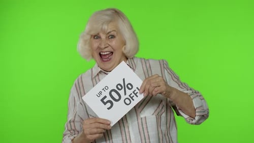 Senior Grandmother Showing Up To 50 Percent Off Inscription, Advertising Discounts, Looking Amazed