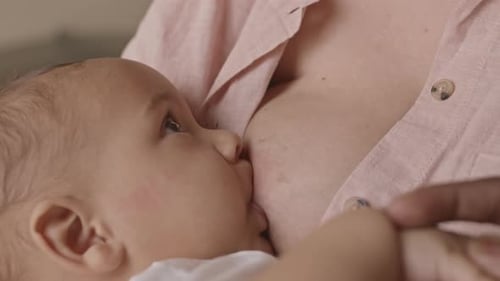 Baby Feeding on Breast