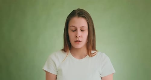 Woman Talking Calmly with a Blank Expression