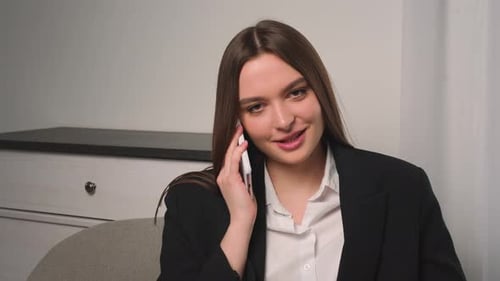 Smiling Businesswoman Talking Phone at Home Office