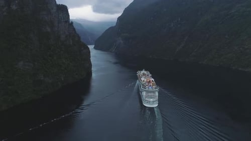 Large Luxury Cruise Ship Is Going in Geiranger Fjord. Green Mountains. Norway. Aerial View