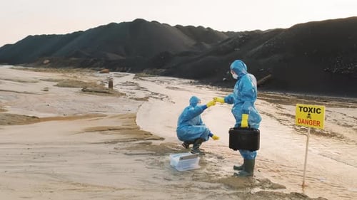 Scientists Investigating Toxic Waste Site in Protective Suits