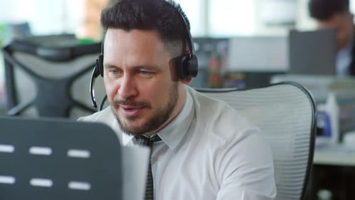 Man Talking With Headset in Office Environment