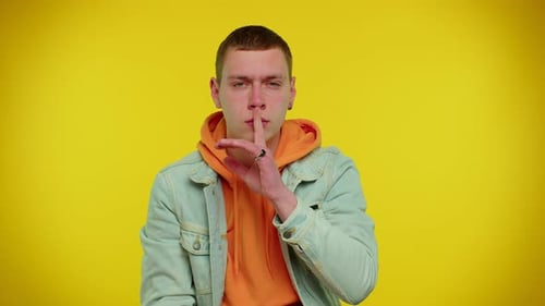 Man Presses Index Finger to Lips Makes Silence Gesture Sign Do Not Tells Secret Shh Be Quiet