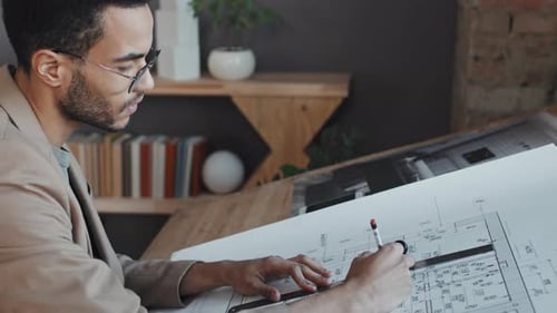 Architect Working on Architectural Design in Office