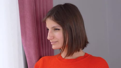 Woman looking out the window