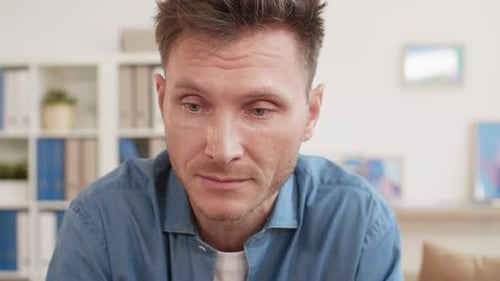 Portrait of Man Crying indoors