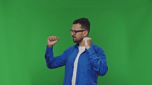 Happy Dancing Handsome Man Over Isolated Green Background