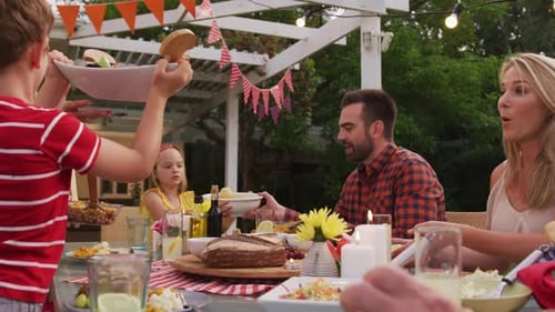 Family Celebrates at Decorated Outdoor Table