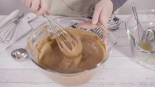 Mixing Light Brown Batter in Glass Bowl