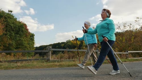 Senior Women Enjoying Active Walk in Rural Setting
